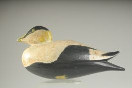 A PAINTED WOODEN DECOY DUCK. 9ins long.