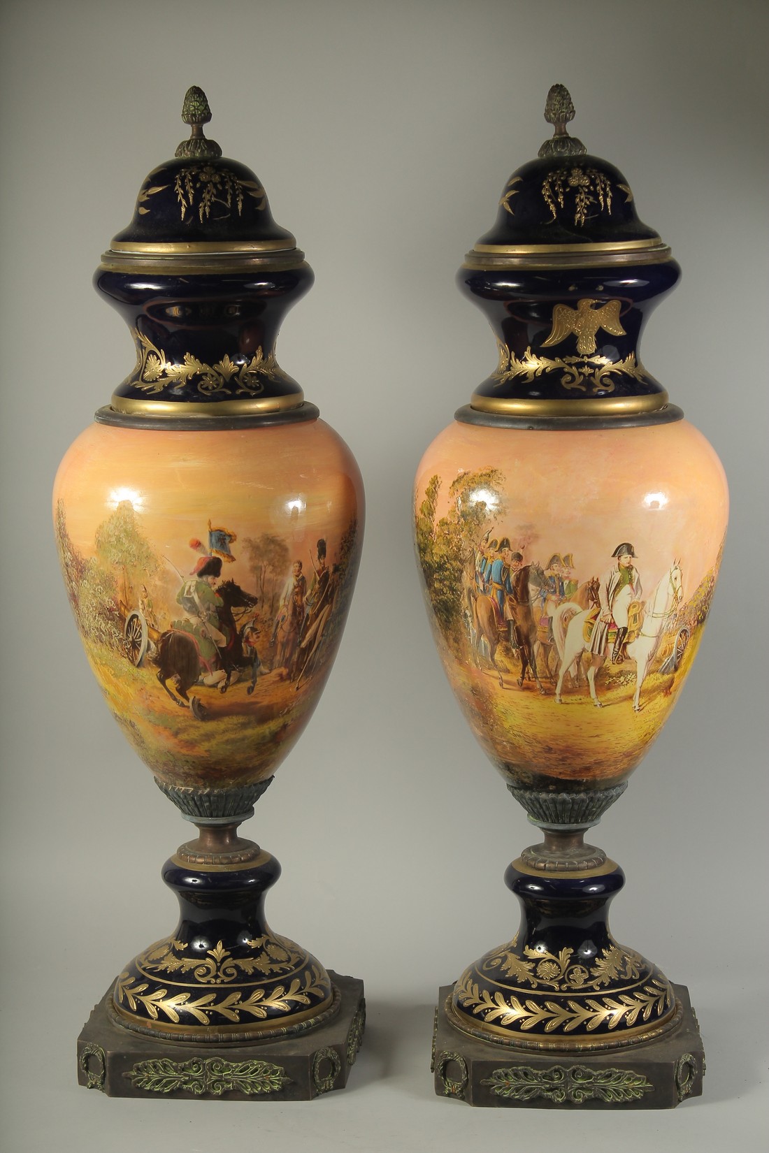 A LARGE PAIR OF PORCELAIN NAPOLEONIC VASES with an all round design of Napoleon. 34ins high. - Image 2 of 2