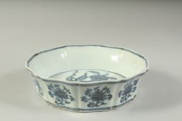A CHINESE BLUE AND WHITE PETAL FORM FLORAL BOWL. 19cms wide.