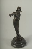 A BRONZE VIOLIN GIRL on a circular marble base. 7.5ins high.