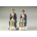 A PAIR OF STAFFORDSHIRE FIGURES OF TURKS. 7.5ins high.