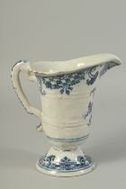 AN 18TH CENTURY ROUEN BLUE AND WHITE DELFT PATTERN JUG with carrying handle. 8ins high.