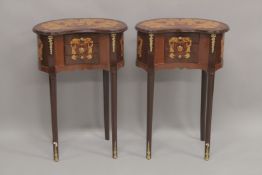 A PAIR OF LOUIS XVITH DESIGN KIDNEY SHAPED BEDSIDE TABLES, with three drawers, on curving legs.