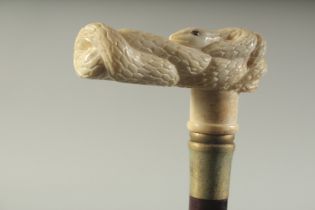 A WALKING STICK WITH CARVED BONE HANDLE "SNAKE".