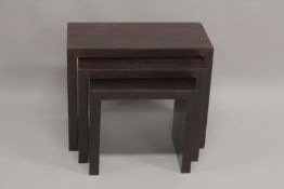 AN ART DECO DESIGN NEST OF THREE TABLES. Largest 2ft x 1ft.