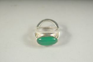 A SILVER AND JADE RING.