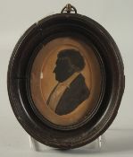 A VICTORIAN OVAL FRAMED SILHOUETTE OF A MAN. 4ins x 3ins.