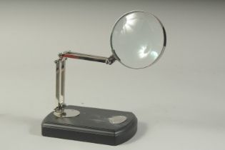 KELVIN & HUGHES, A MAGNIFYING GLASS on a stand.