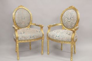 A PAIR OR LOUIS XVITH DESIGN GILTWOOD ARMCHAIRS with oval backs.
