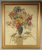 A SUPERB QUALITY SILKWORK PICTURE of a classical urn of flowers with two parakeets. 30ins x 24ins in