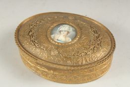 A GOOD 19TH CENTURY OVAL GILT METAL JEWEL BOX the lid inset with a miniature. 5ins long.