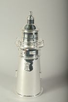 A SILVER PLATE LIGHTHOUSE COCKTAIL SHAKER.