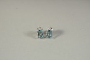 A PAIR OF 18CT WHITE GOLD, DIAMOND AND AQUAMARINE EAR STUDS.