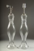 A GOOD PAIR OF SWIRL DESIGN GLASS LAMPS. 20ins high.