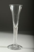 A GEORGIAN WINE GLASS with long, plain tapering bowl and air twist stem. 7.25ins high.