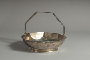 A TIFFANY & CO STERLING SILVER OCTAGONAL BASKET with swing handle. 7ins diameter. Weight 12ozs.
