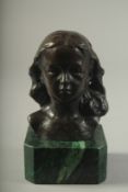 A BRONZE BUST OF A YOUNG GIRL on a marble base. 4.5ins high.