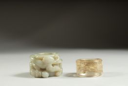 TWO CHINESE ARCHER'S RINGS, one jade and the other crystal.
