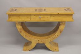 A GOOD INLAID ART DECO DESIGN SIDE TABLE with central drawer and curving supports. 4ft long x 1ft