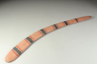 AN ABORIGINAL PAINTED BOOMERANG. 29ins long.