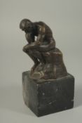 RODIN. A GOOD SMALL BRONZE FIGURE. THE THINKER. 5ins high, on a marble base.