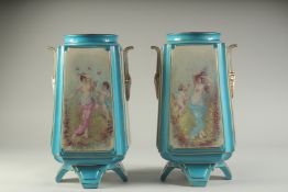 A PAIR OF SEVRES STYLE SQUARE TAPERING PORCELAIN VASES painted with classical panels. 14ins high.