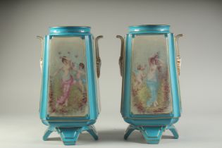 A PAIR OF SEVRES STYLE SQUARE TAPERING PORCELAIN VASES painted with classical panels. 14ins high.