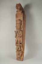 AN 18TH CENTURY CARVED WOOD COLUMN carved with a man and a lion. 26ins long, 4ins wide.