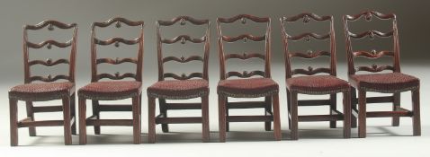 A GOOD SET OF SIX CHIPPENDALE DESIGN MAHOGANY LADDER BACK DINING CHAIRS with padded leather seats.