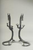 A LARGE PAIR OF CHINESE BRONZE DRAGONS. 15ins high.