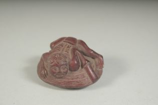 A CARVED HARDWOOD CLAM NETSUKE. Signed. 2ins.