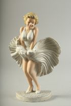 A CAST IRON PAINTED MARILYN MONROE. 13ins high.