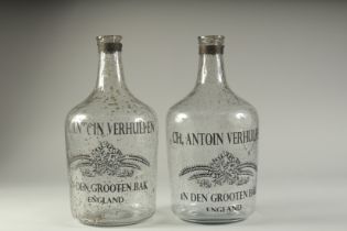 A PAIR OF SPECKLED GLASS BOTTLES "CH ANTOIN VERHULPEN". 14ins high.