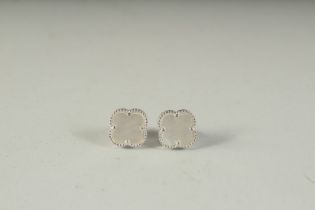 A PAIR OF SILVER AND MOTHER-OF-PEARL EAR STUDS, boxed.