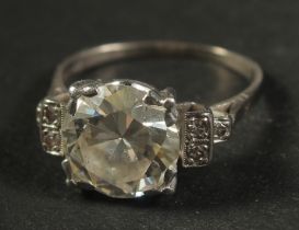A VERY GOOD SOLITAIRE DIAMOND RING, approx. 3cts, three tiny diamonds to each shoulder. Size: N½.