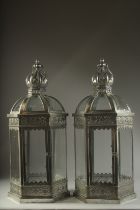 A PAIR OF SILVERED METAL GLAZED LANTERNS with crown tops. 24ins high.