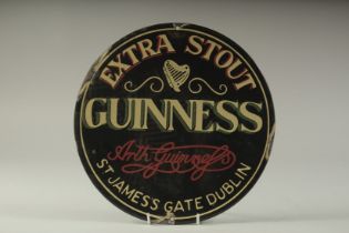 A GUINNESS ENAMEL SIGN. 12ins diameter.