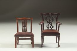 A CHIPPENDALE DESIGN MAHOGANY MINIATURE ARMCHAIR, with drop-in leather seat, on cabriole legs with