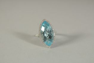 A GOOD 18CT WHITE GOLD, DIAMOND AND BLUE TOPAZ MARQUISE CUT RING.