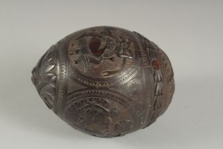 A GOOD CARVED COCONUT with classical panels. 5ins.