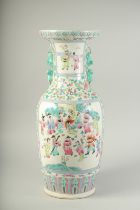 A LARGE CHINESE PORCELAIN CANTON VASE with panels of figures and flowers. 23ins high.