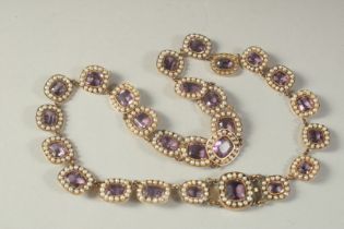 A GOOD AMETHYST AND PEARL NECKLACE with twenty four clusters.