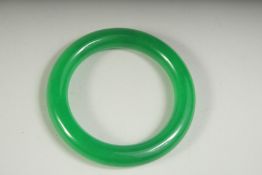 AN APPLE GREEN JADE BANGLE, 3.5ins diameter.