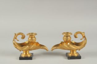 A SUPERB PAIR OF REGENCY GILT BRONZE CANDLESTICKS on marble bases. 5.5ins long.