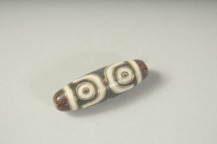 A GOOD INLAID DZI BEAD.