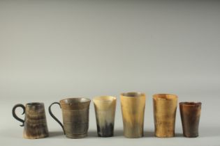 FOUR VARIOUS HORN BEAKERS AND TWO MUGS. 4.25, 4, 3.75, 3.25ins. Mugs 3.75 & 3.5ins.