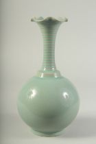 A CHINESE CELADON GLAZE VASE, with petal form rim. 28cms high.