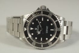 A ROLEX SUBMARINER'S BLACK FACE WRISTWATCH with box and paperwork. No. 3499358 12.08.99, with two