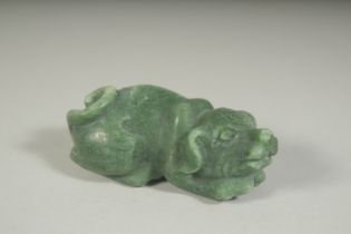 A CARVED JADE PIG, 2.75ins long.