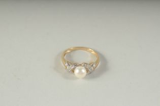 A 9CT GOLD PEARL AND DIAMOND RING, boxed.